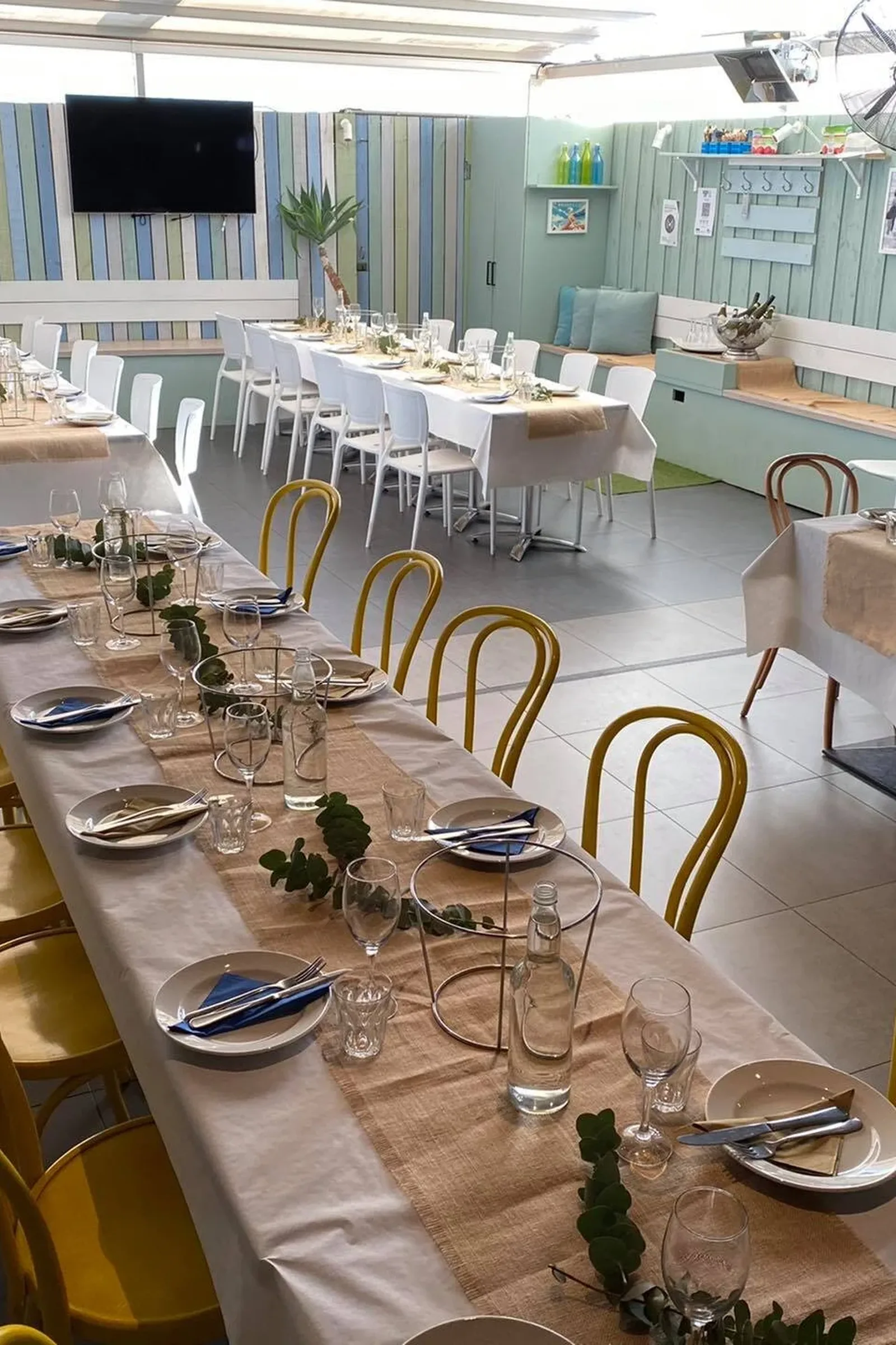 Long tables set for a group booking at Pier 71